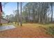 A spacious wooded backyard with mature trees provides a secluded and nature-filled setting at 1057 Forest Path, Stone Mountain, GA 30088