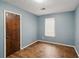 Bedroom features wood-look flooring, and neutral walls at 1057 Forest Path, Stone Mountain, GA 30088