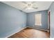 Bedroom features wood-look flooring, and neutral walls at 1057 Forest Path, Stone Mountain, GA 30088