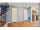 Spacious entryway with wood-look flooring and access to the kitchen and stairs at 1057 Forest Path, Stone Mountain, GA 30088