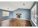 Open living room featuring a fireplace, vaulted ceilings, and plenty of natural light at 1057 Forest Path, Stone Mountain, GA 30088