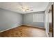 Bedroom features wood-look flooring and a large window at 1057 Forest Path, Stone Mountain, GA 30088