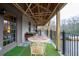 Relax on this inviting back porch overlooking the yard, perfect for enjoying the outdoors at 3091 Colonial Way # D4, Atlanta, GA 30341