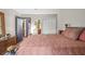 Bedroom featuring a large bed, dresser with mirror, closet and dark blue door at 3091 Colonial Way # D4, Atlanta, GA 30341
