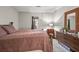 Bedroom featuring a large bed, dresser with mirror, and a window at 3091 Colonial Way # D4, Atlanta, GA 30341