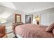 Bedroom featuring a large bed, dresser with mirror, and a closet at 3091 Colonial Way # D4, Atlanta, GA 30341