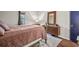 Bedroom featuring a large bed, dresser with mirror, and a window at 3091 Colonial Way # D4, Atlanta, GA 30341