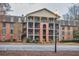 Exterior shot of a multi-story brick apartment building with parking in front at 3091 Colonial Way # D4, Atlanta, GA 30341