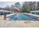 Covered community pool area with ample seating for relaxation and socializing at 3091 Colonial Way # D4, Atlanta, GA 30341