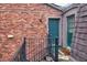 Exterior view of a brick building with the unit entrance and black iron stairs at 3091 Colonial Way # D4, Atlanta, GA 30341