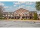 Inviting brick townhouse complex with well-maintained landscaping and a clear view of unit entrances at 3091 Colonial Way # D4, Atlanta, GA 30341