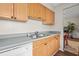Efficient kitchen layout showcases laminate countertops, wood cabinets and essential appliances at 3091 Colonial Way # D4, Atlanta, GA 30341