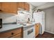 Practical kitchen equipped with white appliances, light cabinetry, and ample counter space for food preparation at 3091 Colonial Way # D4, Atlanta, GA 30341