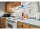 Well-lit kitchen area featuring bright white appliances and ample counter space for food preparation at 3091 Colonial Way # D4, Atlanta, GA 30341