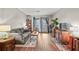 Inviting living room with a comfortable gray sofa and a balcony overlooking the landscape at 3091 Colonial Way # D4, Atlanta, GA 30341