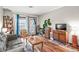 Bright living room with wood floors, a comfortable sofa, and balcony access at 3091 Colonial Way # D4, Atlanta, GA 30341