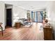 Comfortable living room with a gray sofa, wood floors, and a balcony view at 3091 Colonial Way # D4, Atlanta, GA 30341