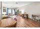 Open-concept living area with wood floors, a comfortable sofa, and balcony access at 3091 Colonial Way # D4, Atlanta, GA 30341