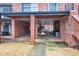 Ground-level parking structure and facade of a brick apartment building at 3091 Colonial Way # D4, Atlanta, GA 30341