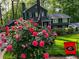 Two-story home featuring a well-maintained lawn and colorful landscaping at 1938 Gotham Ne Way, Atlanta, GA 30324