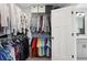 Walk-in closet with ample hanging space, shelves, and access to the Primary bathroom at 1938 Gotham Ne Way, Atlanta, GA 30324