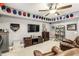 Basement media room with leather seating, tv, and sports memorabilia display at 4240 Hunters Walk Way, Cumming, GA 30028