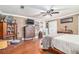 Cozy bedroom with wood floors, vintage accents, and a comfortable bed, creating a relaxing retreat at 204 Emory St, Oxford, GA 30054
