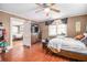 Bedroom with wood floors, ceiling fan and natural light coming through the window at 204 Emory St, Oxford, GA 30054