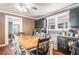 Charming eat-in kitchen featuring wood floors and plenty of natural light at 204 Emory St, Oxford, GA 30054