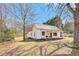 Charming home with a cozy front porch and swing on large lot with mature trees at 204 Emory St, Oxford, GA 30054