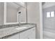 Bathroom featuring neutral walls, granite countertop, and a shower/tub combo at 3236 Abbeywood Dr, Decatur, GA 30034
