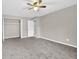 Bedroom featuring gray carpet, neutral walls, and closet space at 3236 Abbeywood Dr, Decatur, GA 30034