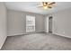 Bright bedroom with a ceiling fan, neutral paint, and a closet space at 3236 Abbeywood Dr, Decatur, GA 30034