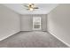 Cozy bedroom featuring neutral walls, soft carpet, and a bright window at 3236 Abbeywood Dr, Decatur, GA 30034