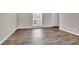 Cozy living room featuring modern gray walls and elegant hardwood floors, creating an inviting atmosphere at 3236 Abbeywood Dr, Decatur, GA 30034