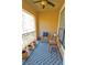 Cozy balcony with blue rug and seating, perfect for relaxing outdoors at 3777 Peachtree Ne Rd # 733, Atlanta, GA 30319
