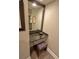 Granite vanity with a framed mirror and elegant seat at 3777 Peachtree Ne Rd # 733, Atlanta, GA 30319
