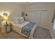 Comfortable bedroom with white bedding, blue accent blanket, and neutral walls, creating a relaxing space at 3777 Peachtree Ne Rd # 733, Atlanta, GA 30319