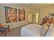 Spacious bedroom featuring unique wall art, neutral carpet, and ample natural light at 3777 Peachtree Ne Rd # 733, Atlanta, GA 30319