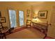 Inviting bedroom with French doors leading to the exterior and decorated with pictures and furniture at 3777 Peachtree Ne Rd # 733, Atlanta, GA 30319