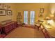 Inviting bedroom with French doors leading to the exterior and decorated with pictures and furniture at 3777 Peachtree Ne Rd # 733, Atlanta, GA 30319