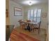 Cozy dining area featuring a rustic table and chairs, complemented by natural light from the window with plantation shutters at 3777 Peachtree Ne Rd # 733, Atlanta, GA 30319