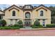 Elegant two-story building with a symmetrical facade, arched windows, and manicured landscaping in a desirable neighborhood at 3777 Peachtree Ne Rd # 733, Atlanta, GA 30319
