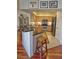 Kitchen with stainless steel appliances, granite countertops, and natural wood cabinetry with a breakfast bar at 3777 Peachtree Ne Rd # 733, Atlanta, GA 30319