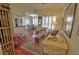 Inviting living room with hardwood floors, plantation shutters, and open access to the dining area at 3777 Peachtree Ne Rd # 733, Atlanta, GA 30319