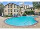 Resort-style pool with waterfall feature, lounge chairs, and lush landscaping at 3777 Peachtree Ne Rd # 733, Atlanta, GA 30319