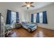 Bedroom with a fun race car bed, bright windows, and elegant hardwood flooring at 1195 Cameron Ne Ct, Atlanta, GA 30306