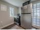 The kitchen features stainless steel appliances and a door leading to the outside at 1195 Cameron Ne Ct, Atlanta, GA 30306