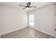 Bedroom with ceiling fan, wood flooring, and a large window for plenty of light at 275 Briscoe Way # 3, Alpharetta, GA 30009