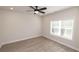 Bedroom featuring a modern ceiling fan, bright window, and neutral paint at 275 Briscoe Way # 3, Alpharetta, GA 30009